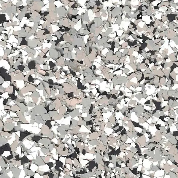 The image shows a close-up of a terrazzo floor consisting of randomly scattered gray, white, and beige stone chips with a smooth texture.