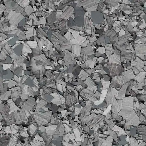 A close-up image of a textured gray surface, featuring various irregularly shaped, overlapping pieces resembling stone or broken concrete.