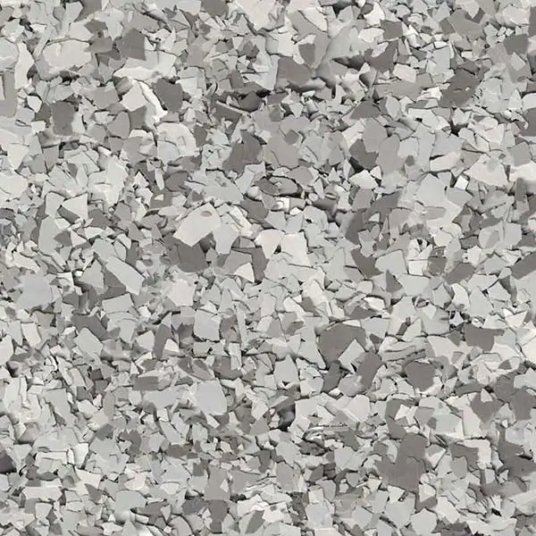 The image shows a close-up of a textured surface covered with irregularly shaped white and grey pieces resembling broken stone or concrete fragments.