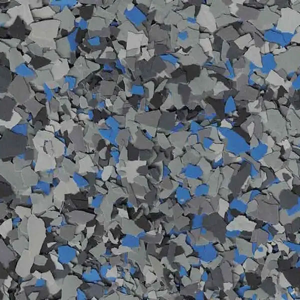 A textured surface composed of gray, black, and blue fragments, resembling a terrazzo pattern with a rugged, abstract aesthetic.