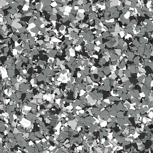 The image shows a textured surface with a mosaic of scattered gray, black, and white fragments, creating a speckled, terrazzo-like pattern.